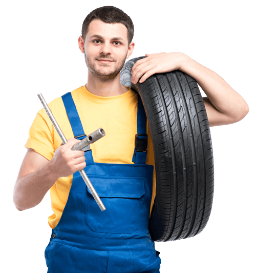 mechanic holding a tire and tire iron